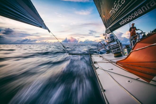 onboard Team Alvimedica. Seb Marsset driving south as equatorial clouds begin to appear on the horizon in every direction,the first signs of ITCZ convergence and volatility - Volvo Ocean Race 2014-15 ©  Amory Ross / Team Alvimedica